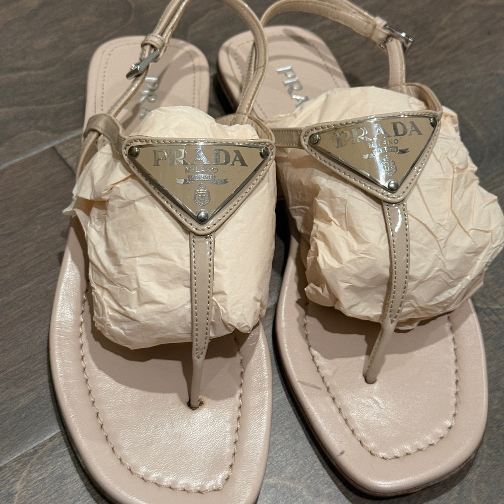 Prada - Patent leather thong sandals in beige